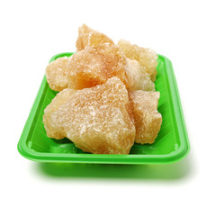 dark crystal sugar on white background