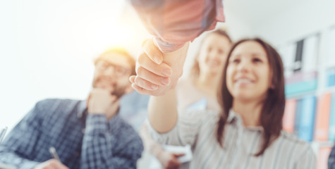 Partnerships and startups: business people shaking hands