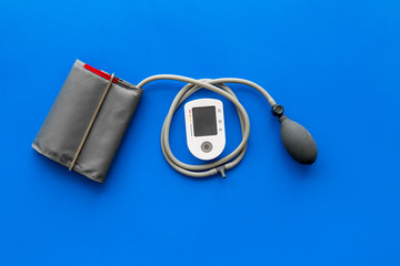 cardiologist work desk with pulsimeter on blue background top view mockup