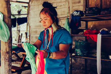 Long Neck Woman wearing at traditional costume. Tribal village Thailand.