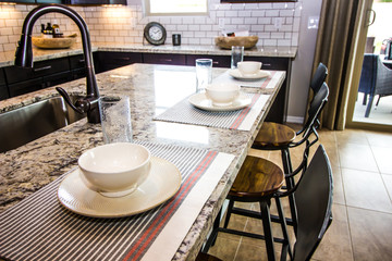 Granite Island Kitchen Counter With Place Settings