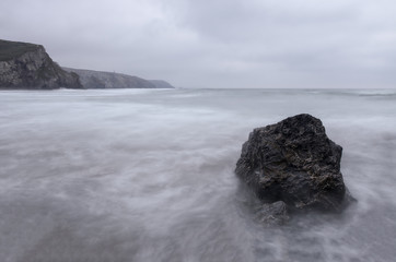 Porthtowan beach with rock slow exposure cornwall england uk 