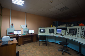 The theme of enterprise and plant automation. Inside the factory control center, monitors with information on the operation of the systems, workplace for the dispatcher and engineer.