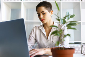 Young businesswoman type on keyboard laptop