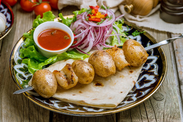 potatoes with fat tail on the grill