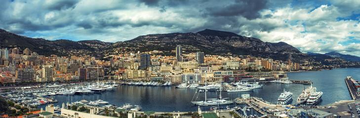 Obraz premium Panoramic view of Monte Carlo marine with yachts and sail boats and town. Monaco