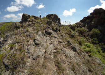 A hiker at Cerro Blanco reserve, near Tanti and Los Gigantes in the Altas Cumbres region, Cordoba, Argentina.