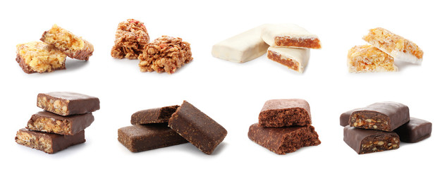 Set of different sweet protein bars on white background