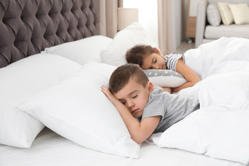 Cute little children sleeping in comfort bed. Space for text