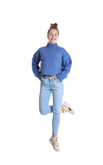 Naklejka premium Pretty teenage girl jumping on white background