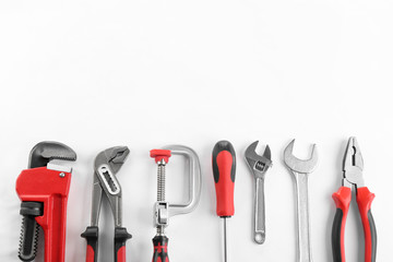 Flat lay composition with construction tools on white background. Space for text