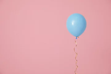 Fotobehang Bright balloon on color background, space for text. Celebration time © New Africa