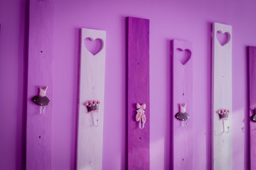 Photo of a decorative stand with hangers for clothes in a ballet school-studio.