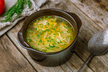 Chicken soup bouillon in a plate