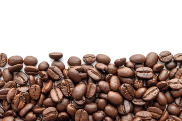 Fototapeta premium Roasted coffee beans isolated on white background. Close-up.