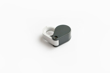 Magnifying glass for diamonds or see the amulet Isolated on a White Background.