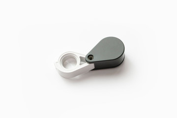 Magnifying glass for diamonds or see the amulet Isolated on a White Background.