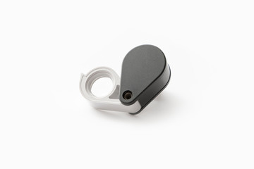 Magnifying glass for diamonds or see the amulet Isolated on a White Background.