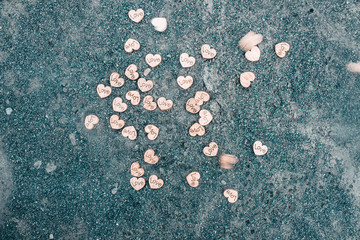 Hearts of wood on the ground. Hearts of wood on a gray background