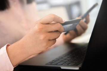 Fototapeta premium Online payment,woman using credit card for online shopping. Cyber Monday Concept