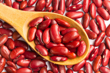 Red Beans Background with Wooden Spoon