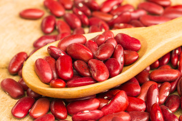 Red Beans Background with Wooden Spoon