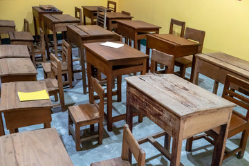 Wooden talble and chair in vintage retro design style on concrete floor.