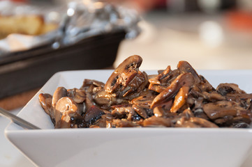 Close up of sliced field mushrooms sauteed in cream