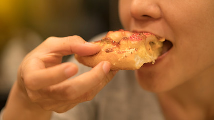 Girl eating pizza
