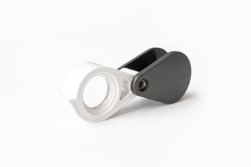 Magnifying glass for diamonds or see the amulet Isolated on a White Background.