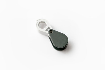 Magnifying glass for diamonds or see the amulet Isolated on a White Background.