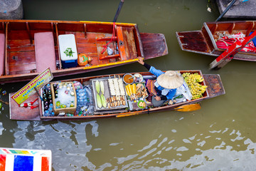 Damnoen Saduak Floating Marke This is a floating Market in Thailand and take a boat then have a great tour at Floating Market Damnoen Saduak, Thailand