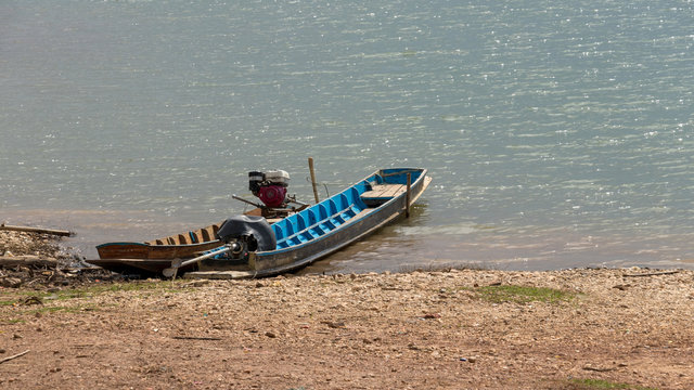 Brown Boat and Blue Boat on Water in Countryside