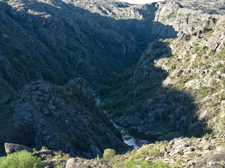 View of the Yuspe river running through the mountains at Cerro Blanco reserve, near Tanti and Los Gigantes, Cordoba, Argentina