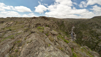 View of the Yuspe river running through the mountains at Cerro Blanco reserve, near Tanti and Los Gigantes, Cordoba, Argentina