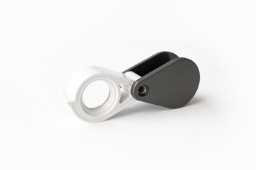 Magnifying glass for diamonds or see the amulet Isolated on a White Background.
