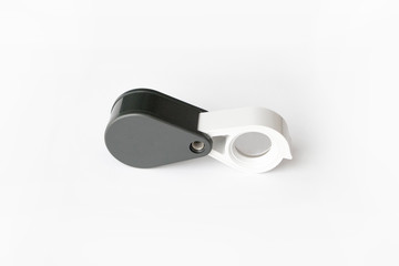 Magnifying glass for diamonds or see the amulet Isolated on a White Background.
