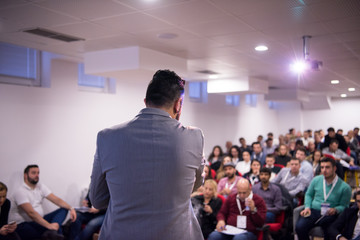 successful businessman giving presentations at conference room