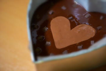 Brownies in heart-shaped prints before baking