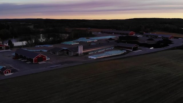 red color poultry farm in Finland at very beautiful sunset