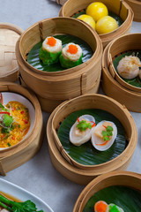 Baskets of dimsum, Chinese steamed food in bamboo basket