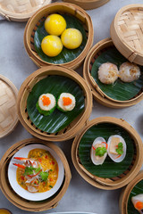 Baskets of dimsum, Chinese steamed food in bamboo basket