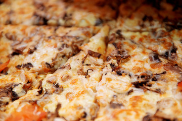 Delicious pizza with mushrooms and cheese close-up.