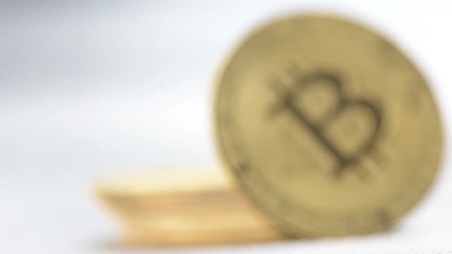 Zoom in slow motion shot of front bit coins