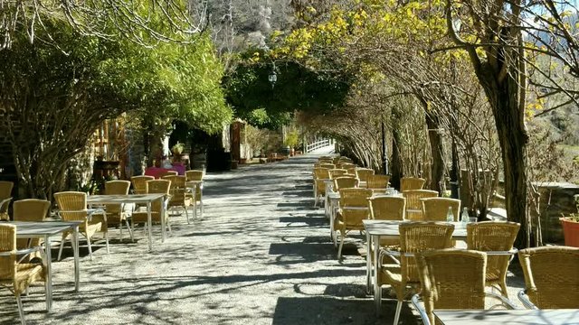 Romantic Outdoor Cafe with a Lot of Greenery Tilit Shot