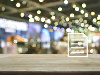 Document flat icon on wooden table over blur light and shadow of shopping mall, Business communication concept