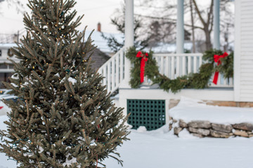 Christmas tree outside home decorated for the holidays