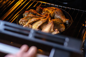 Fried chicken from the oven. Chicken wings, legs grilled
