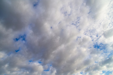 Clouds against the blue sky as a background