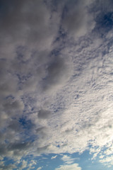 Clouds against the blue sky as a background